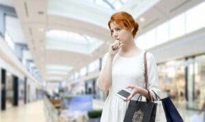 Houston shopper choosing between outlet and traditional mall
